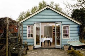 Large shed in the garden with the double doors open