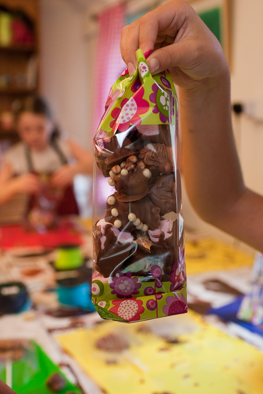 the excitement of children making a bag of chocolates