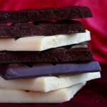 squares of white and dark chocolate in a pile
