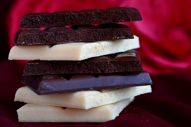 squares of white and dark chocolate in a pile