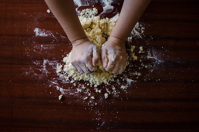 Kneading dough on a floured board