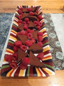 brownies and raspberries on a platter