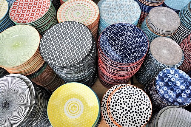 Piles of pottery small plates in different patterns