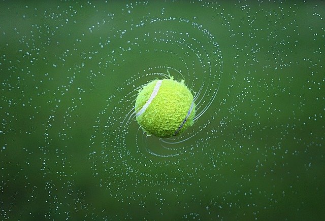 Tennis ball spinning with water