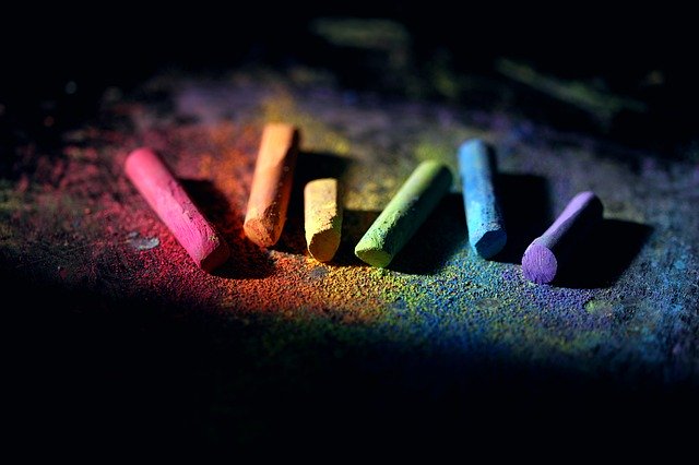 Different coloured chalks on a blackboard